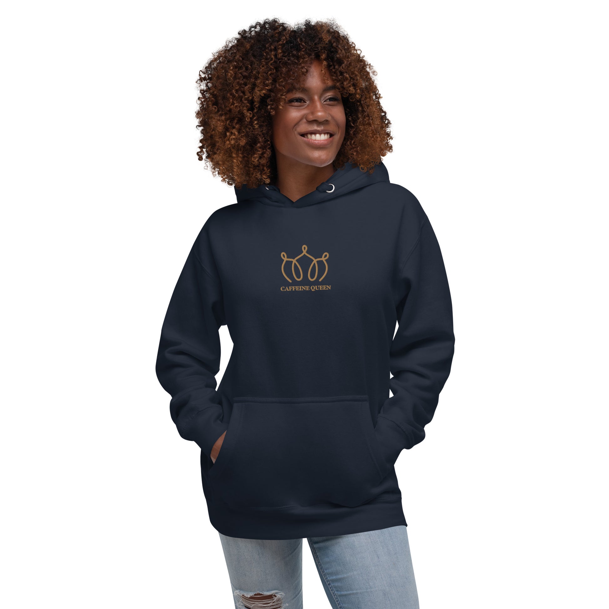 Woman wearing a navy blazer hoodie with an embroidered crown and Caffeine Queen text on the front.